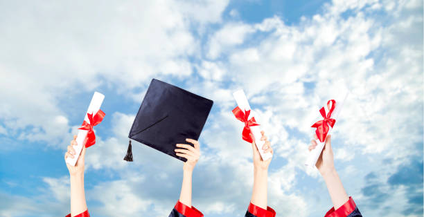 istock Graduation Caps Thrown in the Air 1155508615