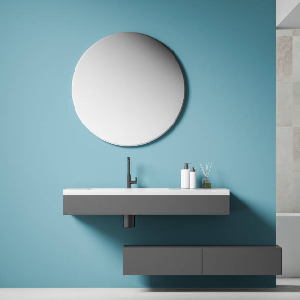 istock Close up of gray sink in blue bathroom 1155509178