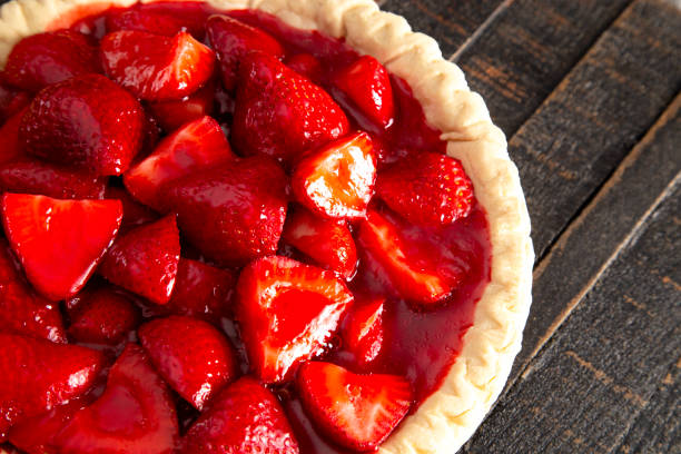 istock Fresh Strawberry Pie on a Distressed Wooden Table 1155509726