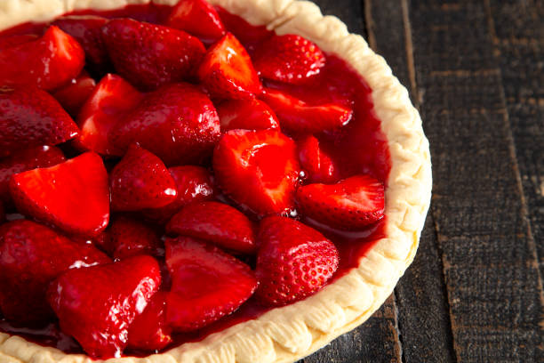 istock Fresh Strawberry Pie on a Distressed Wooden Table 1155509759