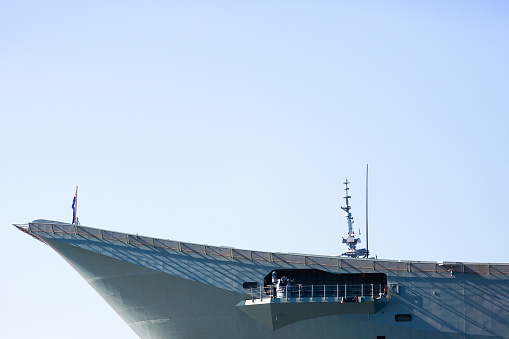 Australian Navy ship bow against blue clear sky background with copy space, full frame horizontal composition
