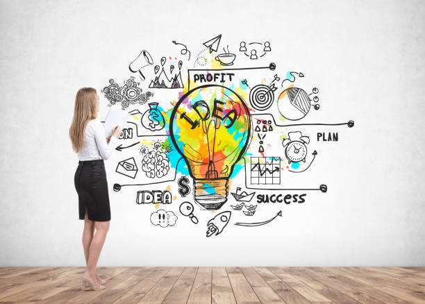 istock Woman with notebook looking at business idea 1155510295