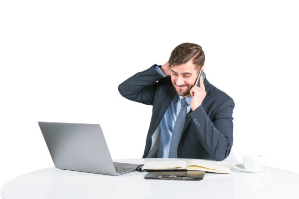 istock Concerned young man in suit on phone at table 1155510322