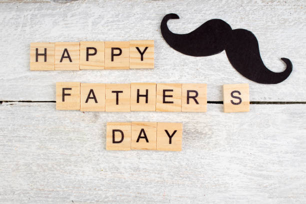 Happy Father's day on wooden background. symbols of love, father, man. happy Valentine's day background. copy space for inscription. stock photo