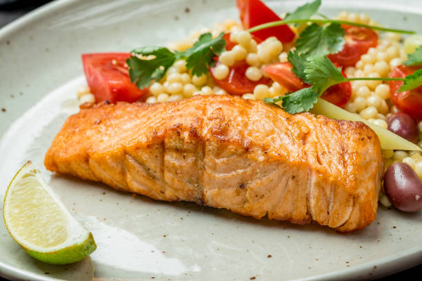 istock Salmon steak on the grill 1155513069