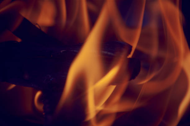 colorful flames dance while the wood burns in the bonfire
