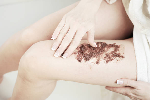 istock Female legs with coffee and chocolate massage scrub. 1155515430
