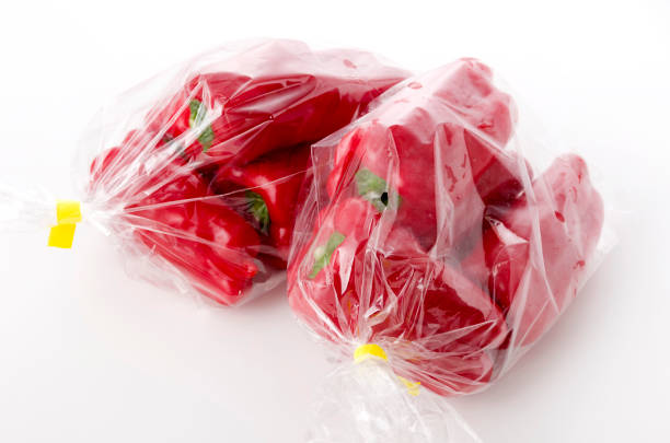 istock Red bell pepper in plastic bag on white background 1155516499