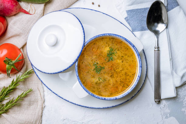 istock Chicken soup bouillon in a plate 1155521016