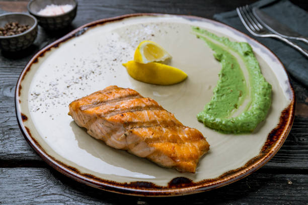 istock Salmon steak on the grill 1155522689