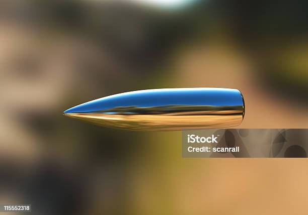 Silver Bullet In Flight Stock Photo - Download Image Now - Bullet, Silver - Metal, Silver Colored