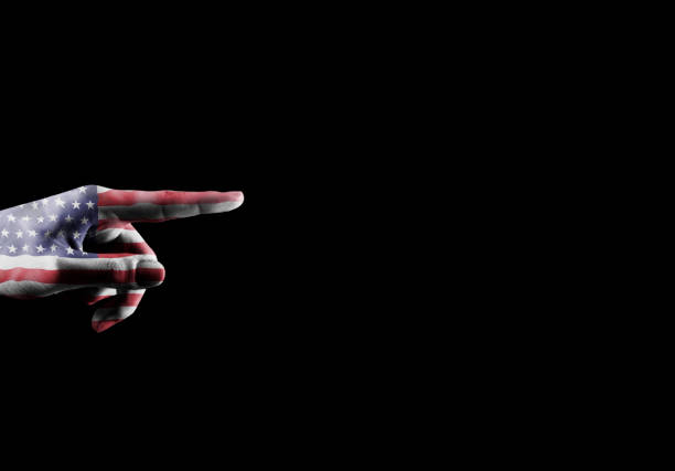 istock SHOWING - Hand with USA flag pointing over empty space for text / Flag concept (Click for more) 1155523619