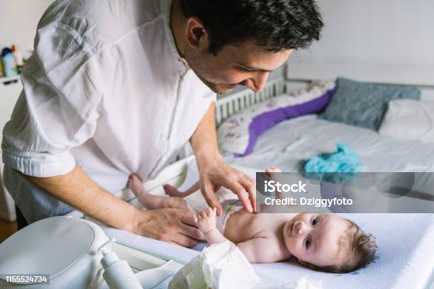 Father With Newborn Baby In Bedroom Stock Photo - Download Image Now - 0-1 Months, 30-39 Years, Adult
