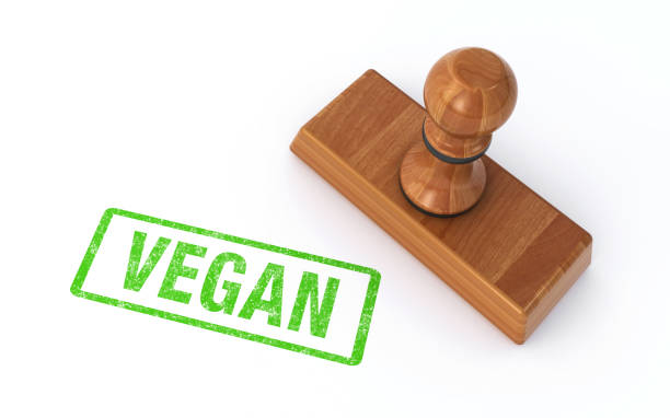 Rubber stamp vegan on white background stock photo