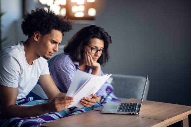 istock Young family having debt problems, not able to pay out their loan. 1155528107