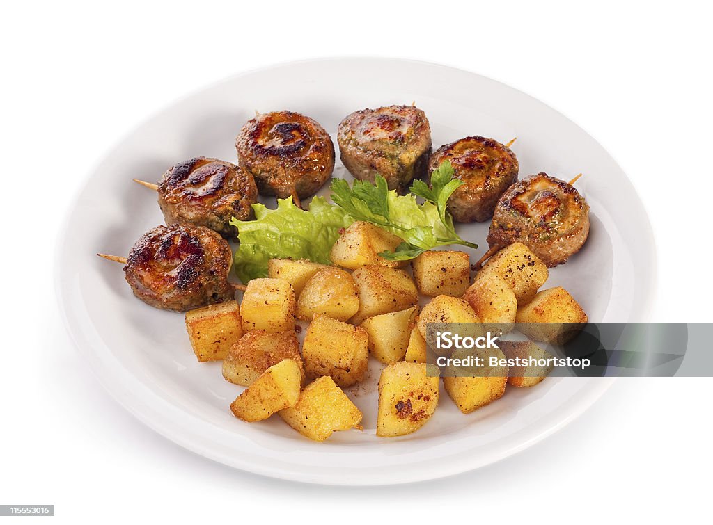 Potatoes with beef roll Fried potatoes with juicy beef roll; isolated on white with clipping path Bacon Stock Photo