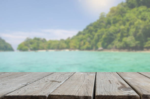istock wood table top sea and beach 1155531125