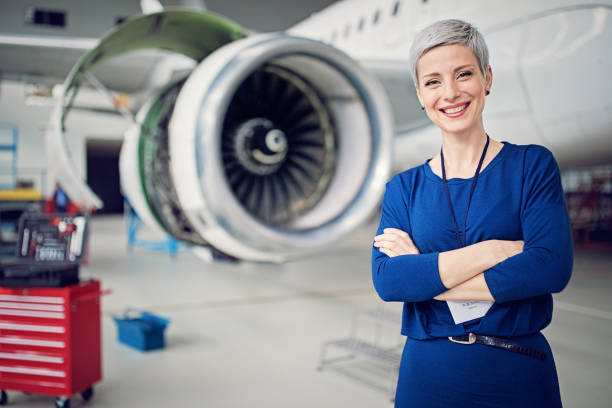 Portrait of airplane hangar manager Portrait of airplane hangar manager aerospace industry stock pictures, royalty-free photos & images