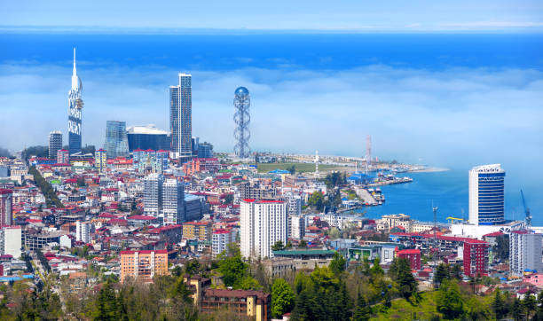 Batumi city, Georgia, view of the skyline in the morning haze Batumi city, Georgia, panoramic view of the skyline, harbour and Black sea coast in cloudy haze batumi stock pictures, royalty-free photos & images