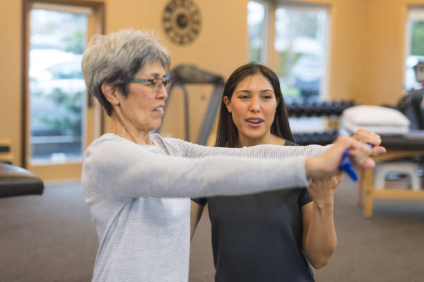 istock A senior woman works with her occupational therapist 1155533426