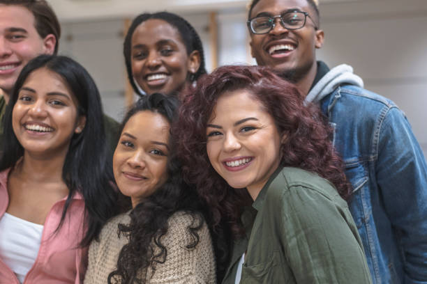 istock Multi-Ethnic Group of University Students Sitting Inside Together 1155533548