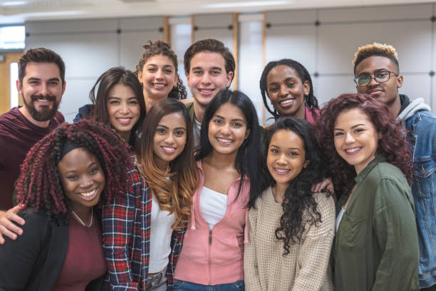 istock Multi-Ethnic Group of University Students Sitting Inside Together 1155533562