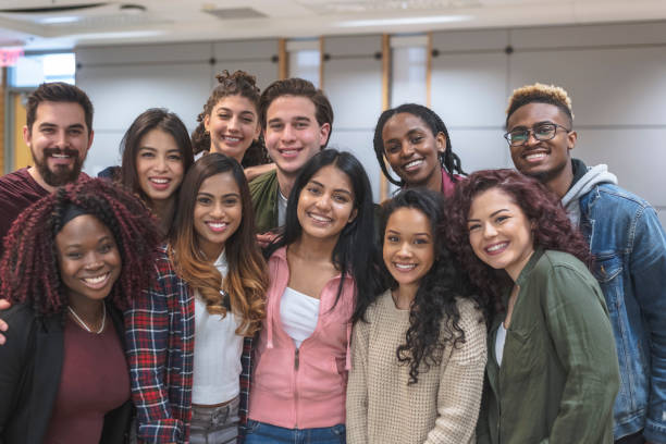 istock Multi-Ethnic Group of University Students Sitting Inside Together 1155533593