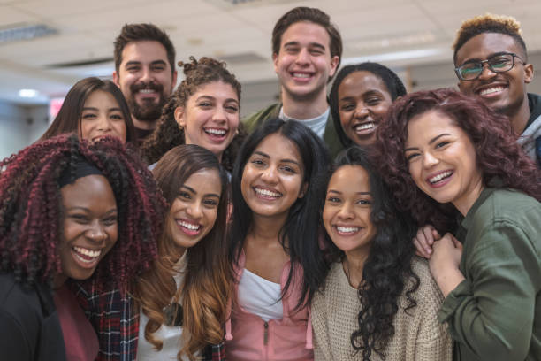 istock Multi-Ethnic Group of University Students Sitting Inside Together 1155534111