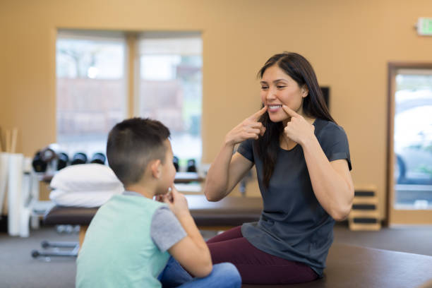 istock Speech therapist works with a young ethnic boy 1155537779
