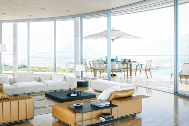 Balcony with wicker chairs, coffee table, carpet, palm trees. Luxury home. Vacation home. Outdoor furniture. Summer; summertime.  