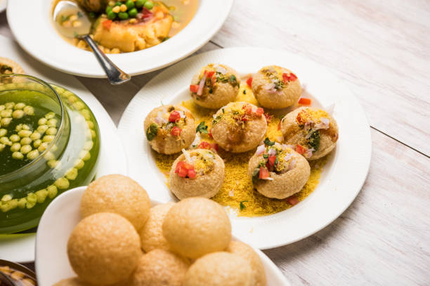 Bombay Chat food in group group of Bombay chat food includes golgappa/panipuri, bhel-puri, sev-poori, dahipuri, Ragda pattice, raj kachori etc. selective focus raj kachori stock pictures, royalty-free photos & images