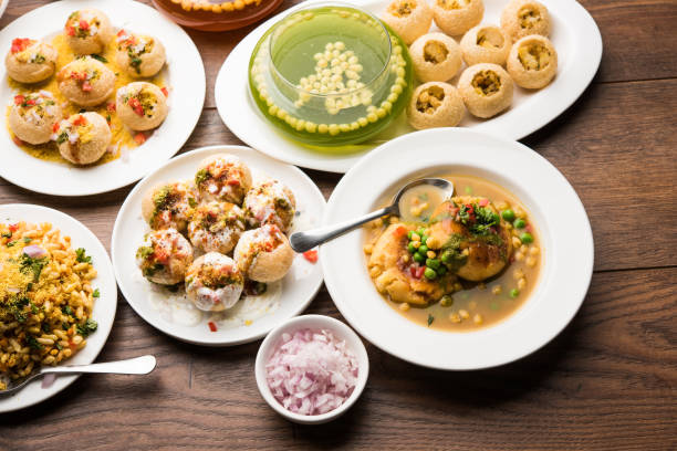 Bombay Chat food in group group of Bombay chat food includes golgappa/panipuri, bhel-puri, sev-poori, dahipuri, Ragda pattice, raj kachori etc. selective focus raj kachori stock pictures, royalty-free photos & images