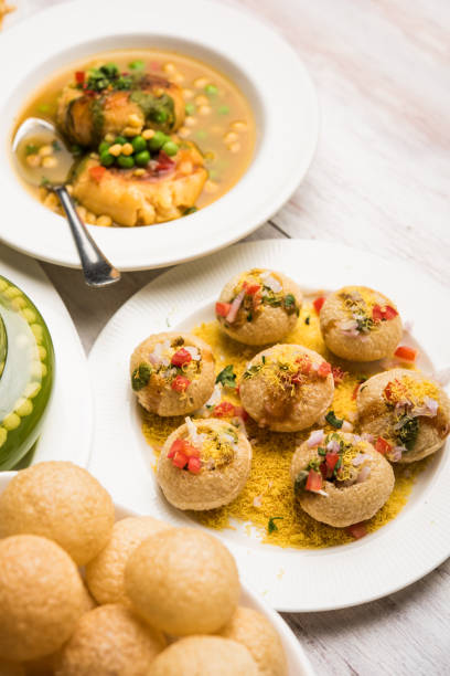 Bombay Chat food in group group of Bombay chat food includes golgappa/panipuri, bhel-puri, sev-poori, dahipuri, Ragda pattice, raj kachori etc. selective focus raj kachori stock pictures, royalty-free photos & images