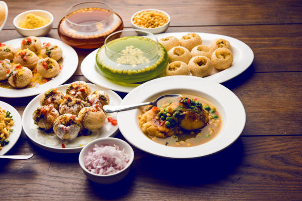 Bombay Chat food in group group of Bombay chat food includes golgappa/panipuri, bhel-puri, sev-poori, dahipuri, Ragda pattice, raj kachori etc. selective focus raj kachori stock pictures, royalty-free photos & images