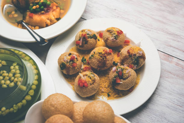 Bombay Chat food in group group of Bombay chat food includes golgappa/panipuri, bhel-puri, sev-poori, dahipuri, Ragda pattice, raj kachori etc. selective focus raj kachori stock pictures, royalty-free photos & images
