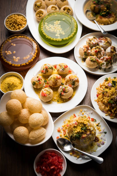 Bombay Chat food in group group of Bombay chat food includes golgappa/panipuri, bhel-puri, sev-poori, dahipuri, Ragda pattice, raj kachori etc. selective focus raj kachori stock pictures, royalty-free photos & images
