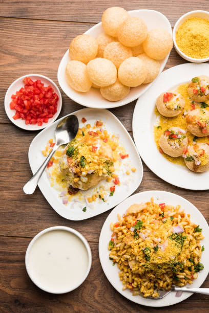 Bombay Chat food in group group of Bombay chat food includes golgappa/panipuri, bhel-puri, sev-poori, dahipuri, Ragda pattice, raj kachori etc. selective focus raj kachori stock pictures, royalty-free photos & images