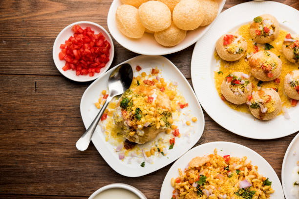 Bombay Chat food in group group of Bombay chat food includes golgappa/panipuri, bhel-puri, sev-poori, dahipuri, Ragda pattice, raj kachori etc. selective focus raj kachori stock pictures, royalty-free photos & images