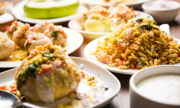 Bombay Chat food in group group of Bombay chat food includes golgappa/panipuri, bhel-puri, sev-poori, dahipuri, Ragda pattice, raj kachori etc. selective focus raj kachori stock pictures, royalty-free photos & images