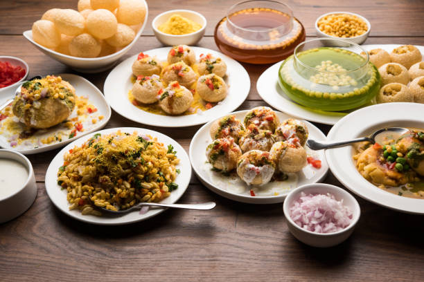 Bombay Chat food in group group of Bombay chat food includes golgappa/panipuri, bhel-puri, sev-poori, dahipuri, Ragda pattice, raj kachori etc. selective focus raj kachori stock pictures, royalty-free photos & images