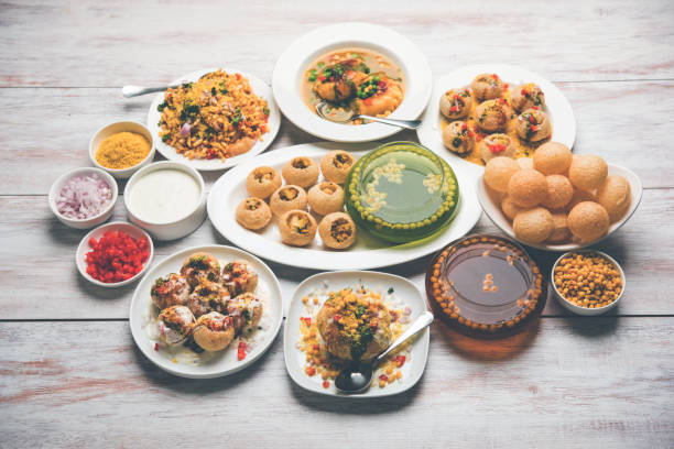 Bombay Chat food in group group of Bombay chat food includes golgappa/panipuri, bhel-puri, sev-poori, dahipuri, Ragda pattice, raj kachori etc. selective focus raj kachori stock pictures, royalty-free photos & images