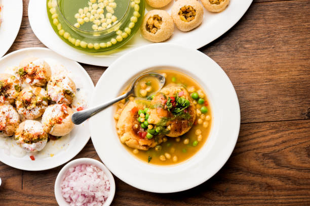 Bombay Chat food in group group of Bombay chat food includes golgappa/panipuri, bhel-puri, sev-poori, dahipuri, Ragda pattice, raj kachori etc. selective focus raj kachori stock pictures, royalty-free photos & images