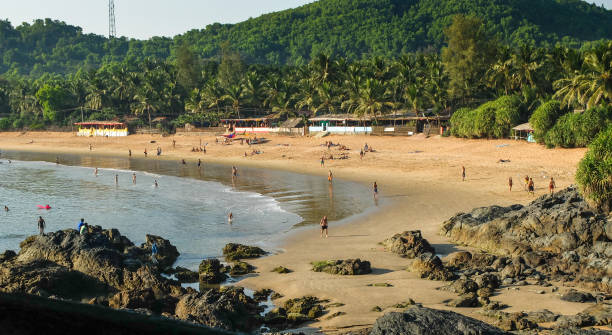 OM BEACH,GOKARNA,KARNATAKA, INDIA-FEBUARY 2ND, 2018: Tourists and travelers enjoying the sun,sea and leisure activities at this increasingly popular beach in India. IIndiauthwestern India. karnataka stock pictures, royalty-free photos & images