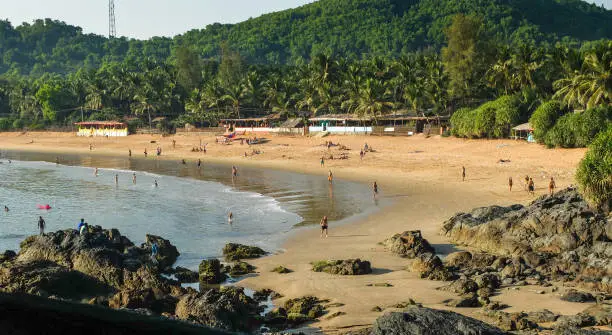 Tourists and travelers enjoying the sun,sea and leisure activities at this increasingly popular beach in India. IIndiauthwestern India.