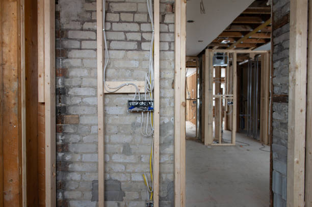 istock Electrical wires connected into a metal box in a residential renovation site 1155546952