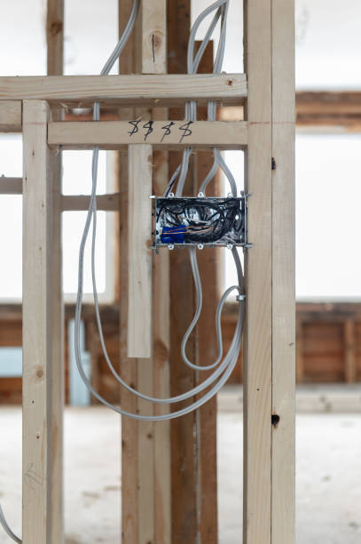 istock Electrical wires connected into a metal box in a residential renovation site 1155546985