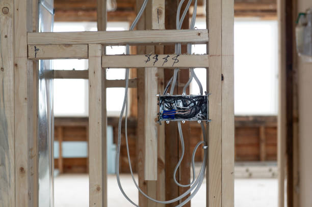 istock Electrical wires connected into a metal box in a residential renovation site 1155546988