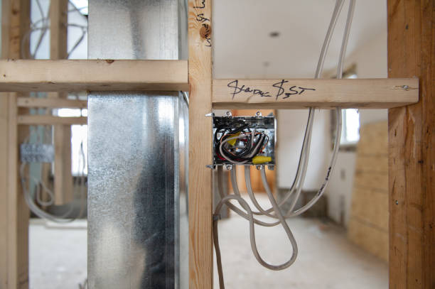 istock Electrical wires connected into a metal box in a residential renovation site 1155546992