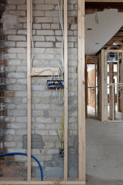 istock Electrical wires connected into a metal box in a residential renovation site 1155547033