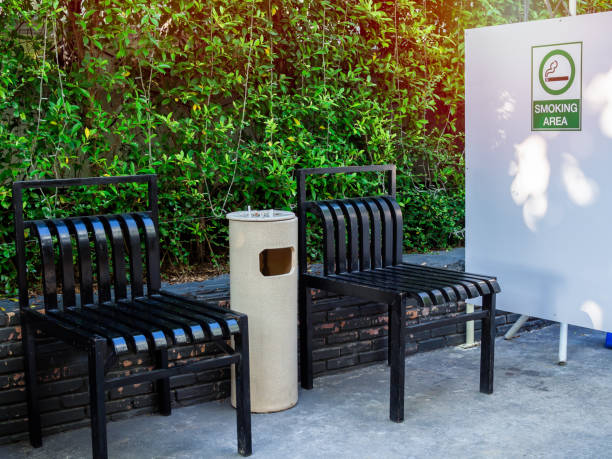 istock Black chairs with ashtray in smoking area 1155548727